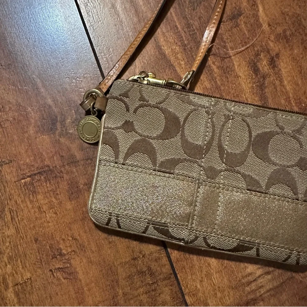 Coach brown and gold sateen horizontal stripe monogram wristlet